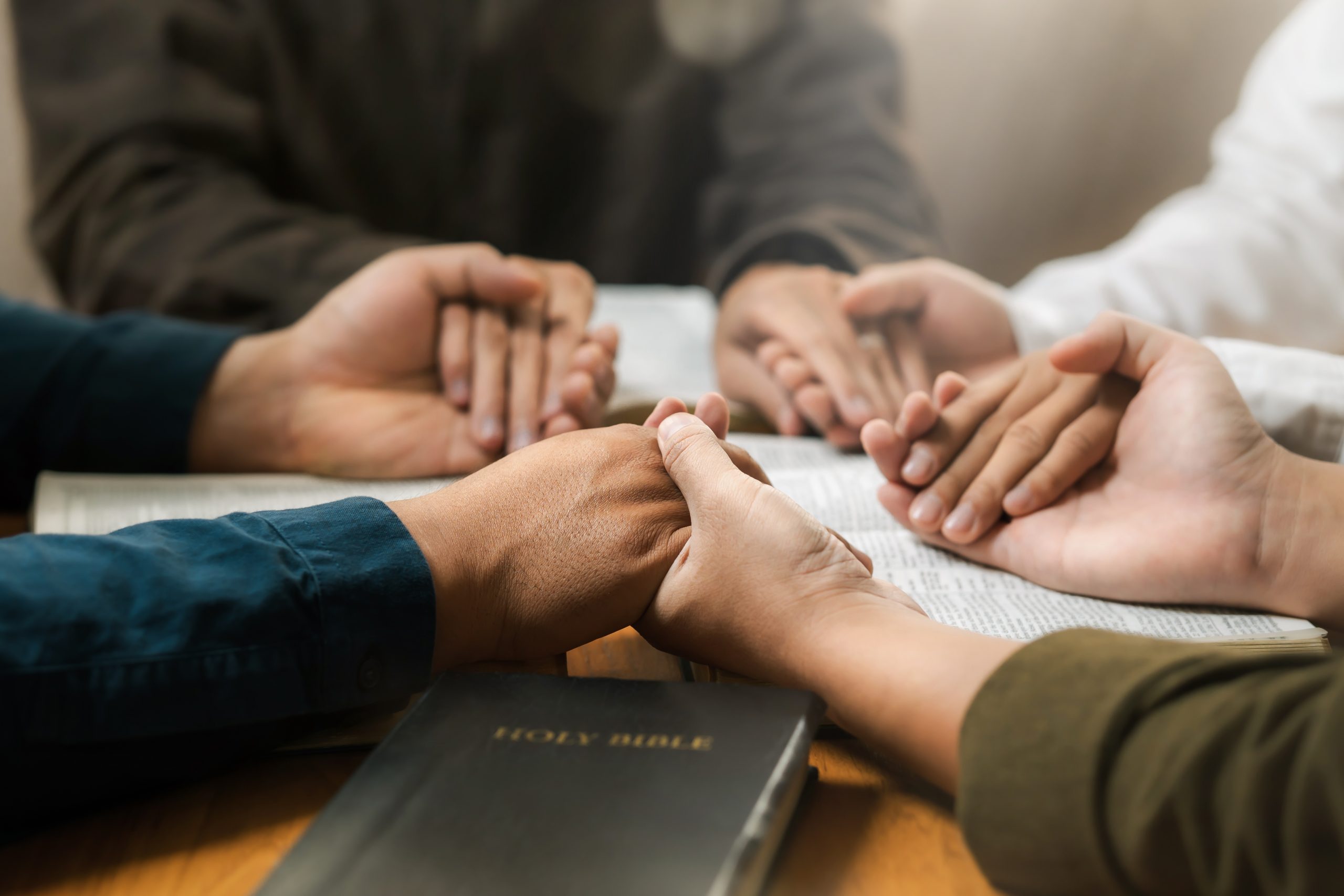Group,Of,Young,Christians,Praying,,Holding,Hands,And,Praying,Together